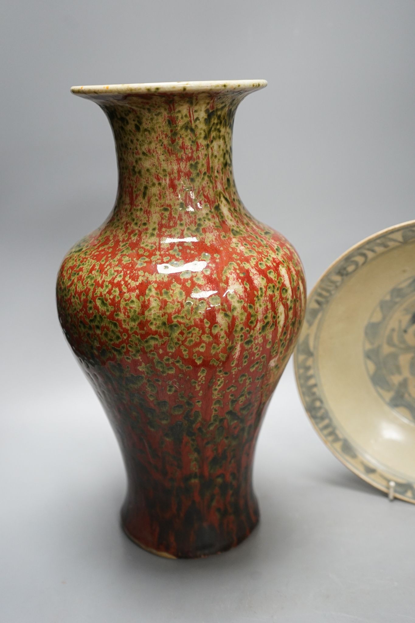 A Chinese flambe vase and two Ming dishes, vase 36cm